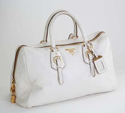 PRADA Handtasche, off-white Leder, 2 Tragehenkel, Schnallenapplikation, mit Zahlenschloss, innen champagnerfarb. Stoff mitPrada Stickerei, ca. 40 x ...