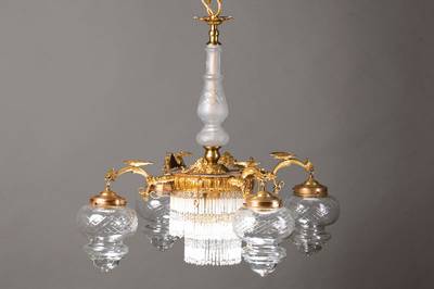 Deckenlampe, Spanien, um 1910, sog. Drachenleuchter, massive Messingmontur, 4 Arme als geflügelte Fabeldrachenkopfabschlüsse, einen Ausleger ...