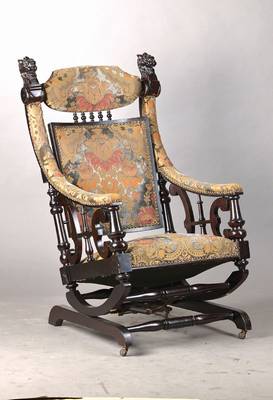 Herrenschaukelstuhl, wohl Belgien, um 1870-90, geschwungene Form, Lehnenbekrönung als Chimärenkopf, Armlehnen mit Balusterstützen u.Bandwerk, auf ...
