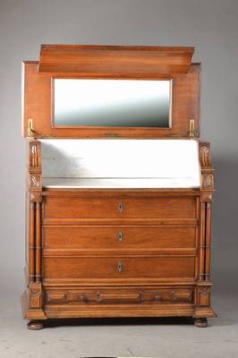 Waschmöbel, Elsass, um 1880/90, Nussbaum massiv, Platte aufklappbar mit innenseitigem Spiegel u. Marmorauskleidung, Unterteil 4- schübig, seitl. je ...