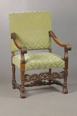 Stuhlsessel, deutsch, um 1880/90, im Frühbarock-Stil, Nussbaum massiv, Handläufe in Akanthusblattform, reich halbplastisch geschnitzter Mittelsteg, ...