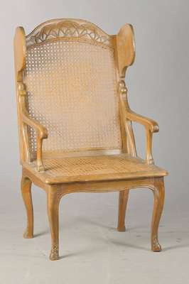 Ohrenbackensessel, deutsch, um 1870, Buche, mit Rattangeflecht, dieses intakt, sparsame Kerbschnitzereien, Alterssp., H. ca. 116 cm, Sh. ca. 43 cm