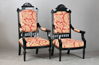 Paar Kaminsessel / Armlehnsessel, deutsch, um 1880/90, Weichholz, später schwarz gefaßt, stilübliche Ornamentik, H. ca. 177 cm, Sh. ca.44 cm