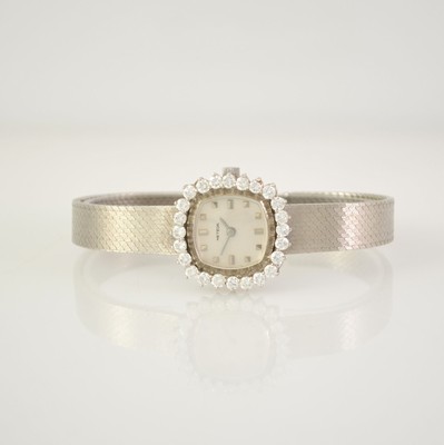 METEOR Damenarmbanduhr in WG 585/000 mit Diamantlünette, Handaufzug, Deutschland um 1965, Boden aufgedr., Diamanten zus. ca. 1,9 ct (1 Stein ...