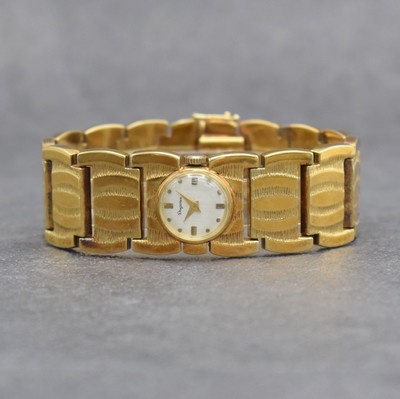 DUGENA ausgefallene Damenarmbanduhr in GG 585/000, Handaufzug, Schweiz um 1970, Boden aufgedr., silb. Zifferbl. m. aufgel. Indizes altersbed. l. fl., ...
