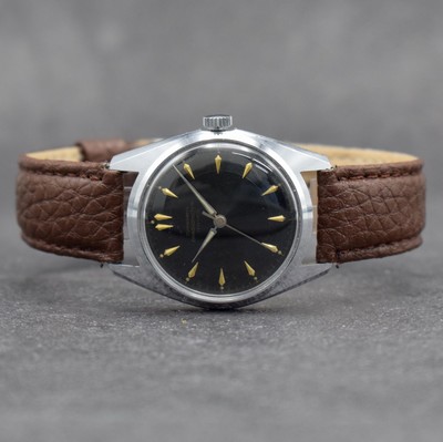 JUNGHANS Chronometer Herrenarmbanduhr mit schwarzem Zifferblatt Kal. 82/1, Deutschland um 1960, Handaufzug, verchr. Geh., Stahlboden geschr., ...