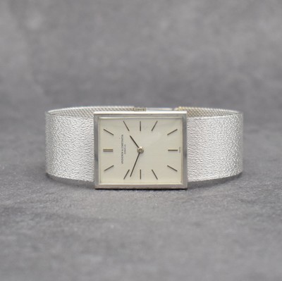 VACHERON & CONSTANTIN Herrenarmbanduhr in WG 750/000 Referenz 7139, Handaufzug, Schweiz um 1975, 2-teil. Geh., Boden aufgedr., Milanaiseband, silb. ...