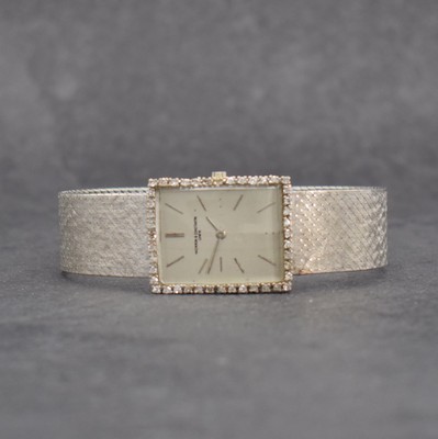 VACHERON & CONSTANTIN Armbanduhr in WG 750/000, Schweiz um 1965, Handaufzug, Boden aufgedr., Milanaiseband in WG 750/000, silb. Zifferbl. rest., 2x ...