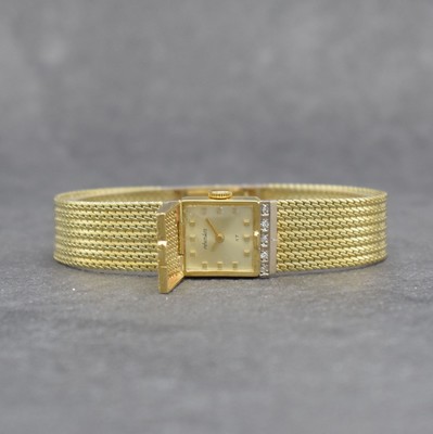 RHODOS Diamantbesetzte Damenarmbanduhr in GG 585/000, Schweiz um 1965, Handaufzug, durchgehendes Milanaiseband, silb. Zifferbl. unter ...