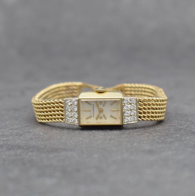 MOVADO Diamantbesetzte Damenarmbanduhr in GG 585/000, Schweiz/USA um 1960, Handaufzug, gedr. Geh., anges. Milanaiseband, orig. Krone, silb. Zifferbl. ...