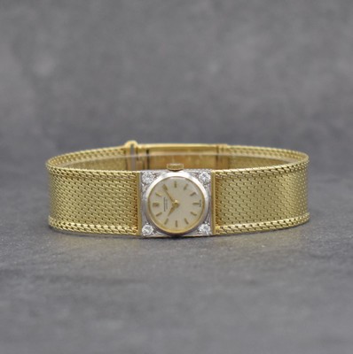 IWC Damenuhr in GG 750/000 im neutralen Band in GG 585/000, Schweiz um 1955/1975, Handaufzug, gedr. Geh. m. 4 Diamanten bes., Milanaiseband m. ...