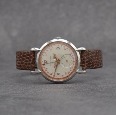 Jaeger-LeCoultre Herrenuhr mit Vollkalender in Stahl, Schweiz um 1945, Handaufzug, gedr. Geh. m. Tropfen-förm. Anstößen, silb./rose- farb. ...