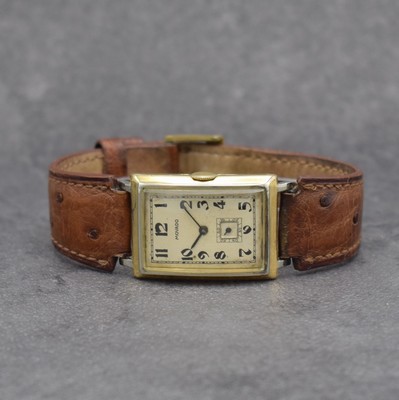 MOVADO Herrenarmbanduhr in GG 750/000, Schweiz um 1930, Handaufzug, 2-teil. Scharniergeh., Zifferbl. m. arab. Zahlen rest., schwarze Zeiger, Kal. ...