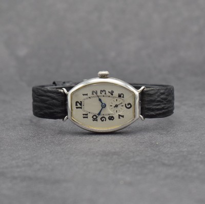 SCHILD FRERES & Co. frühe, tonneauförmige Damenarmbanduhr in 875/00 Silber, Handaufzug, Schweiz um 1930, Scharnier- Glasrand & -Boden m. Gravur, ...