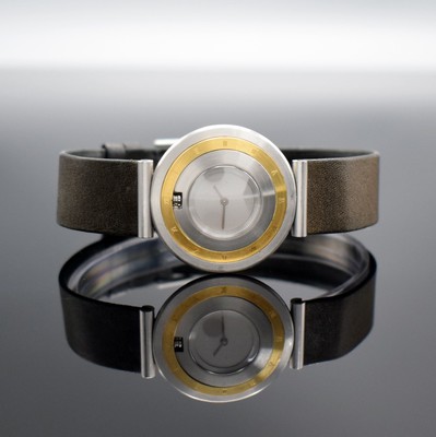 MILUS Far Side Armbanduhr Referenz 340.018, Schweiz um 1995, quarz, 3-teil. Wendegehäuse in Edelstahl/Gold komb., Design Paul Junod, Boden verschr., ...
