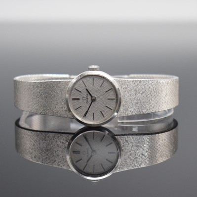 OMEGA Damenarmbanduhr in WG 585/000, Schweiz um 1973, Handaufzug, Boden aufgedr., orig. Milanaiseband in WG 585/000, silb. Strukturzifferbl. m. ...