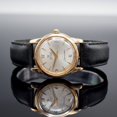 OMEGA Seamaster Armbanduhr, Schweiz um 1956, Automatik, Ref. 2828-10 SC, Edelstahl m. Goldhaube, Boden aufgedr., silb. Zifferbl. m. gold. Ind. & ...