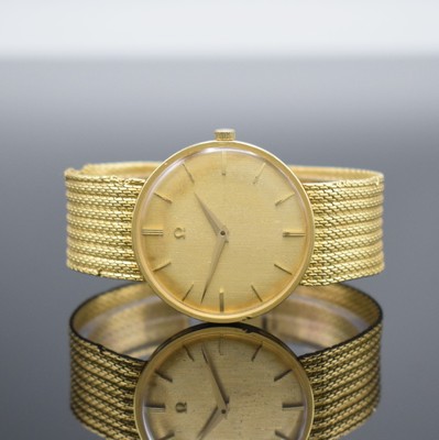 OMEGA Herrenarmbanduhr in GG 750/000 Referenz 14372/14376, Schweiz um 1960, Handaufzug, Boden & Glasrand aufgedr., Band altersbed. besch., ...