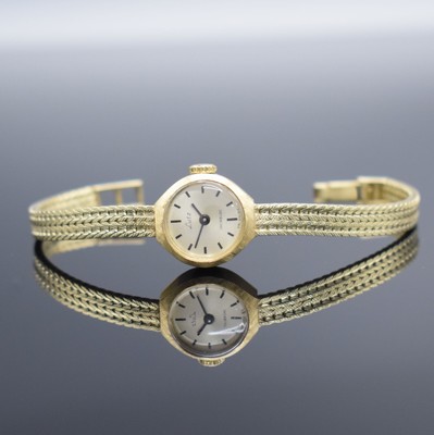 LUTZ Damenarmbanduhr in GG 585/000, Schweiz um 1965, Handaufzug, Boden aufgedr., Goldband in 585/000, silb. Zifferbl. m. schwarzen Std.-Ind. & ...
