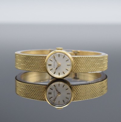 ETERNA Damenarmbanduhr in GG 750/000, Schweiz um 1970, Handaufzug, Boden aufgedr., orig. Goldband in 750/000, silb. Zifferbl. m. aufgel. Std.-Ind., ...