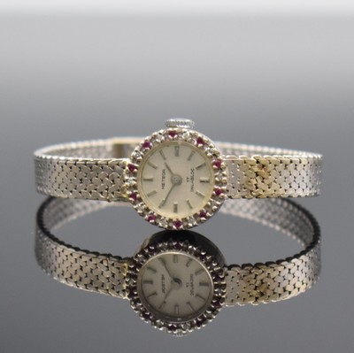 METEOR Damenarmbanduhr in WG 750/000, Handaufzug, Schweiz um 1965, Boden aufgedr., Lünette m. Steinbesatz, silb. Zifferbl. m. aufgel. Indizes ...