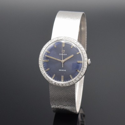 Herrenarmbanduhr in WG 750/000 mit Omega Werk & Diamantbesatz, Schweiz 1960er Jahre, Handaufzug, neutr. Geh. m. neutr. Band, Lünette aufw. m. ...