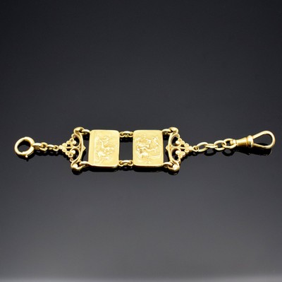 Taschenuhr-Chatelaine in GG 750/000, 19 Jhd., mit Karabiner & Federring, aufw. dekoriert, m. Durchbrucharbeit, Mittelteile mit Figuren aus ...