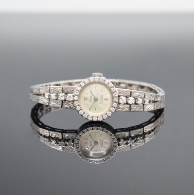 ERBE Damengoldbanduhr in WG 750/000 mit Diamantbesatz, Schweiz um 1960, Handaufzug, WG 750/000 Band, Boden aufgedr., silb. Zifferbl. m. silb. Ind. & ...
