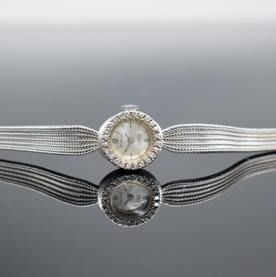 KRÖNER Damenarmbanduhr in WG 585/000, um 1960, Handaufzug, 2-teil. Geh., Boden aufgedr., WG 585/000 Milanaiseband, Lünette mit Diamanten bes., ...