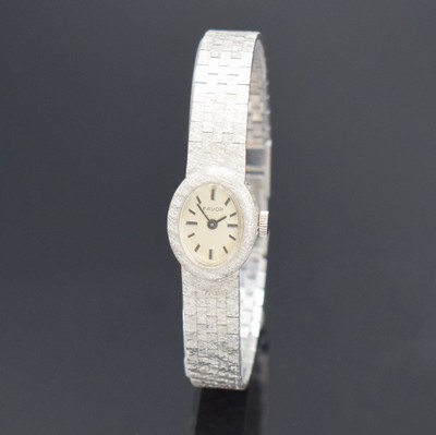 FAVOR Damenarmbanduhr in WG 585/000, Schweiz um 1970, Handaufzug, Boden aufgedr., silb. Zifferbl. m. aufgel. Std.-Ind., schwarze Zeiger, Kal. INT ...