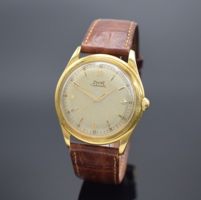 PIAGET Herrenarmbanduhr in GG 750/000 Referenz 11690, Schweiz um 1956, Automatik, Boden m. Widmung verschr., silb. Zifferbl. pat./fl., gold. Ind. & ...