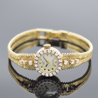 ANKER Damenarmbanduhr mit Diamantbesatz in GG 585/000, Schweiz um 1970, Handaufzug, GG 585/000 Armband, Boden aufgedr., silb. Zifferbl. pat., aufgel. ...