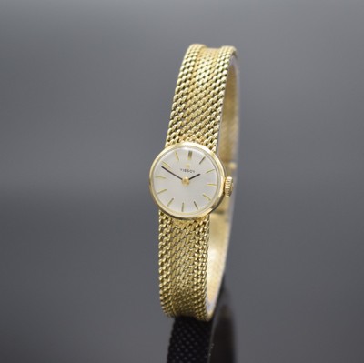 TISSOT Damenarmbanduhr in GG 585/000, Schweiz um 1960, Handaufzug, Boden aufgedr., Geh. an GG 585/000 Armband, silb. Zifferbl. m. gold. Std.-Ind., ...