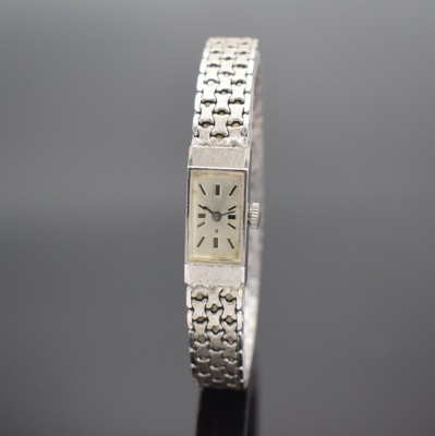 Damenarmbanduhr in WG 585/000, Schweiz 1960er Jahre, Handaufzug, Geh. an Goldband in WG 585/000, Boden aufgedr., silb. Zifferbl. m. aufgel. Std.-Ind. ...