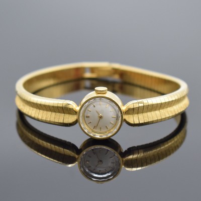 GG 750/0000 Damenarmbanduhr, Schweiz 1960er Jahre, Handaufzug, GG 750/000 Armband, Boden aufgedr., silb. Zifferbl. m. gold. Std.-Ind. & Zeiger, Werk ...