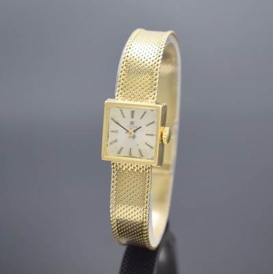 TISSOT Damenarmbanduhr in GG 585/000, Schweiz um 1965, Handaufzug, Geh. an Goldband in GG 585/000, Boden aufgedr., silb. Zifferbl. pat./fl., aufgel. ...