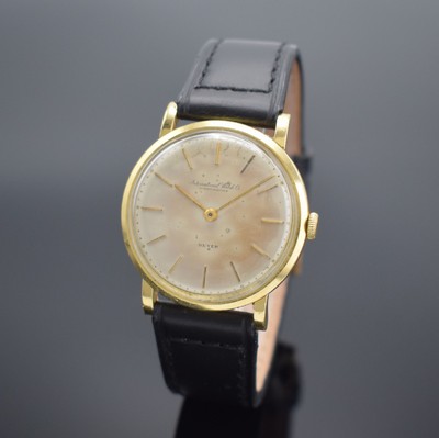 IWC / BEYER Armbanduhr in GG 750/000, Schweiz um 1952, Handaufzug, Boden & Glasrand aufgedr., silb. Zifferbl. m. Verkäufersignatur Beyer ...