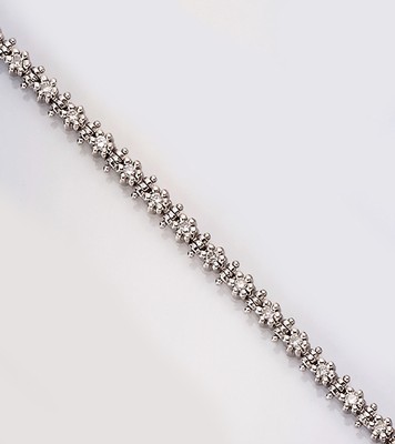 18 kt Gold Brillant-Linienarmband, WG 750/000 gepr., 29 Brillanten zus. ca. 2.0 ct Weiß/si, L. ca. 18 cm, Kastenschloß mit Sicherheitsacht, ca. ...