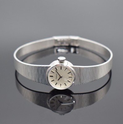 TISSOT Damenarmbanduhr in WG 585/000, Schweiz um 1970, Handaufzug, 2-teil. Gehäuse, Boden aufgedr., Milanaiseband, silb. Zifferbl. m. aufges. ...