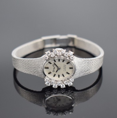 DRAFA Damenarmbanduhr in WG 585/000 mit Diamanten, Schweiz um 1970, Umbau auf quarz später, 2-teil. Geh., Boden aufgedr., Milanaiseband, Lünette ...