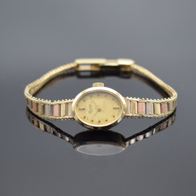 QUARTZ De Luxe Damenarmbanduhr in GG/RG/WG 585/000, Schweiz um 1965, Boden aufgedr., gold., horizontal gestreiftes Zifferbl. fl./pat., Anz. v. Std. & ...