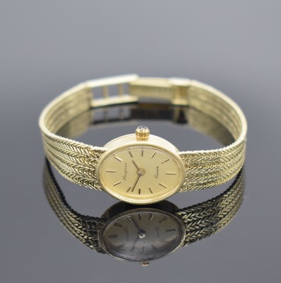 BERGANA Damenarmbanduhr in GG 585/000, Schweiz um 1980, quarz, Geh. an Goldband in GG 585/000, champagnerfarb. Zifferbl. m. aufgel. Std.-Ind., gold. ...