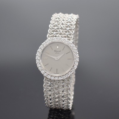 CHOPARD Diamantbesetzte Damenarmbanduhr in WG 750/000, Schweiz um 1965, Handaufzug, gedr. Geh., integr. geflochtenes orig. Band, grau- silb. ...
