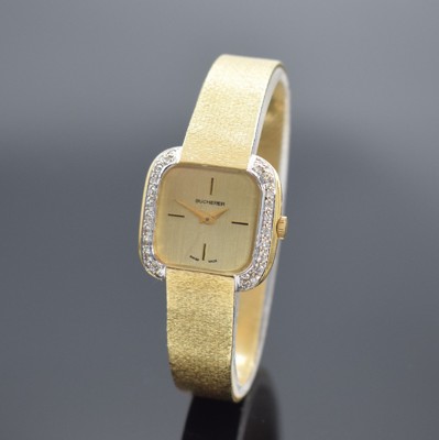 BUCHERER Damenarmbanduhr in GG 750/000, Schweiz um 1965, Handaufzug, Boden aufgedr., Milanaiseband, Lünette mit Diamanten bes., gold. Zifferbl., ...