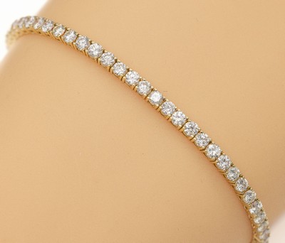 14 kt Gold Brillant-Linienarmband, GG 585/000, 62 Brillanten zus. ca. 5.00 ct feinesWeiß-Weiß/vs-si, L. ca. 18.5 cm, ca. 8.5 g, Kastenschloss mit ...