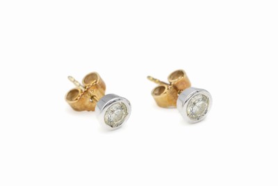 Paar 14 kt Gold Brillant-Ohrstecker, GG/WG 585/000, 2 in WG gefasste Brillanten zus. ca. 0.60 ct l.get.Weiß/si