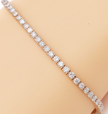 14 kt Gold Brillant-Linienarmband, RG 585/000, 62 Brillanten zus. ca. 4.00 ct feinesWeiß-Weiß/vs-si, L. ca. 18.5 cm, Kastenschlossmit 2 ...