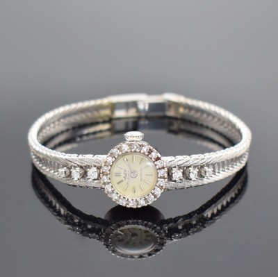 ARCTOS Damenarmbanduhr in WG 750/000 mit Diamanten, Schweiz um 1965, Handaufzug, Boden aufgedr., Lünette m. Diamanten bes., silb. Zifferbl. ...