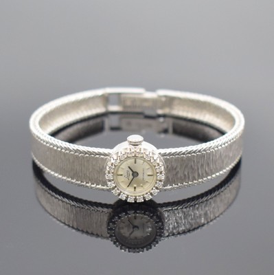 LESSA Damenarmbanduhr in WG 750/000 mit Diamanten, Schweiz um 1960, Handaufzug, Milanaiseband, Boden aufgedr., Lünette aufw. m. Diamanten bes., ...