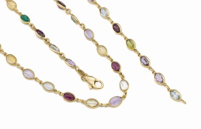 18 kt Gold Farbstein-Schmuckset, GG 750/000, best. aus Armband und Collier, ovalfacett. Farbsteine u.a. Citrin, Peridot, Aquamarin, L. ca. 20 und 40 ...